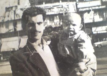 صورة من العام 1966  لغالب عكر حين كان رضيعاً يحمله والده