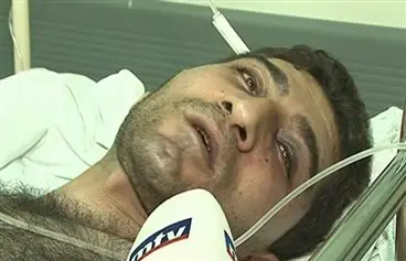 ربيع الأحمد ملقىً على الفراش في المستشفى